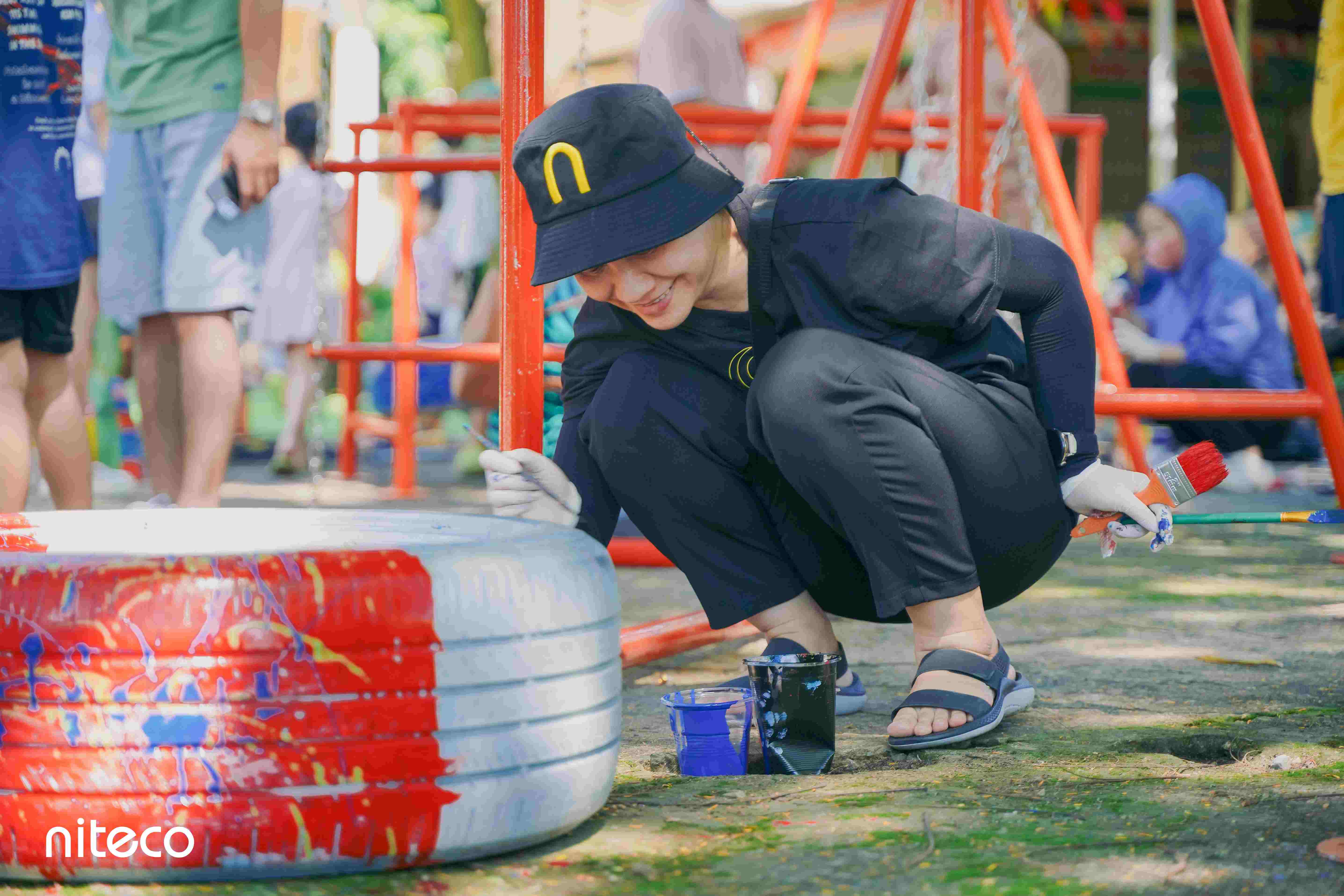 Volunteers constructing playground equipment
