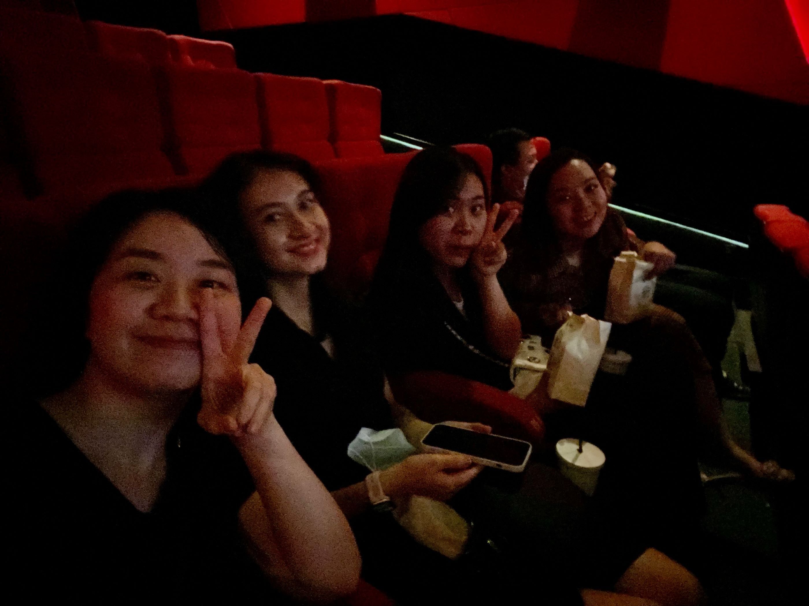Nitecans smiling together during cinema outing