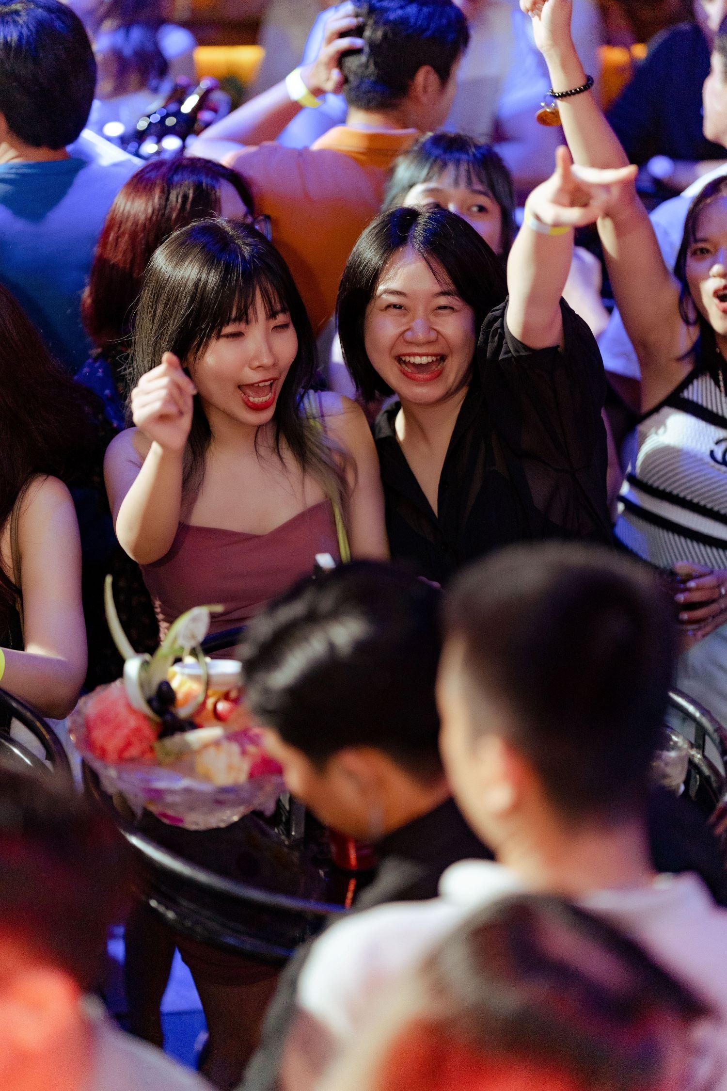 Colleagues laughing and bonding at night hangout