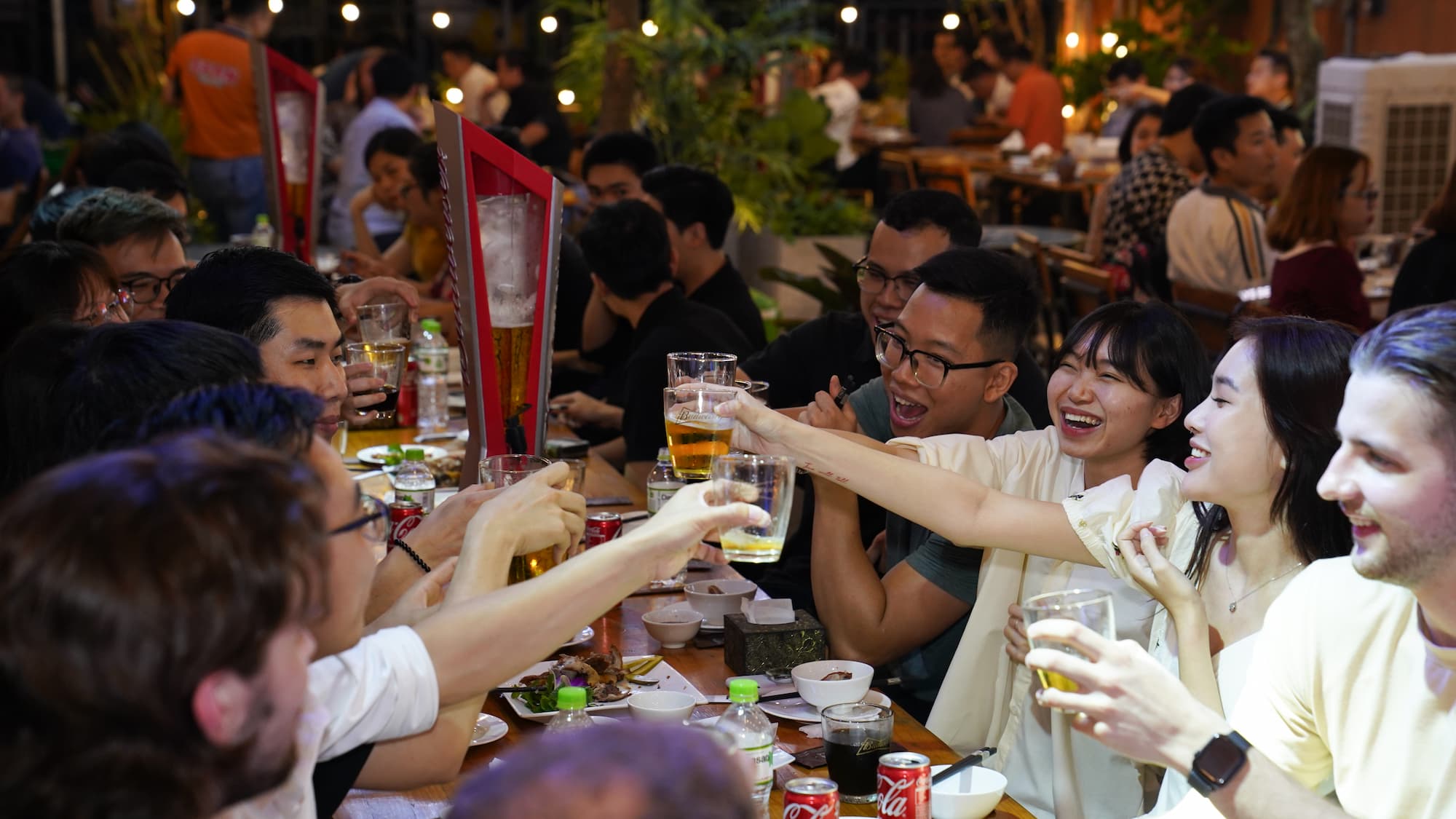 Guests raising glasses together during the beer fest​