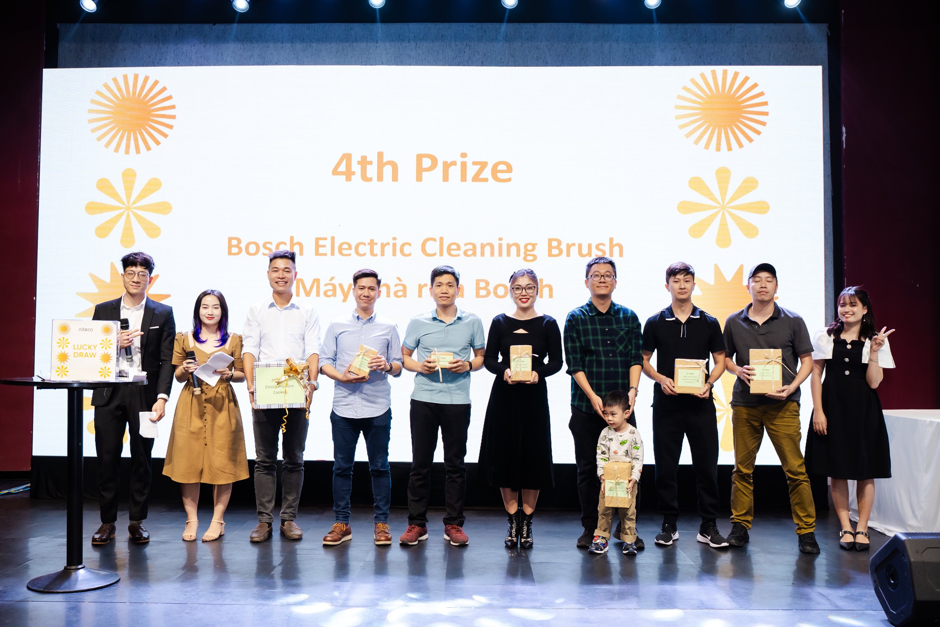 Winner raising prize on stage during lucky draw