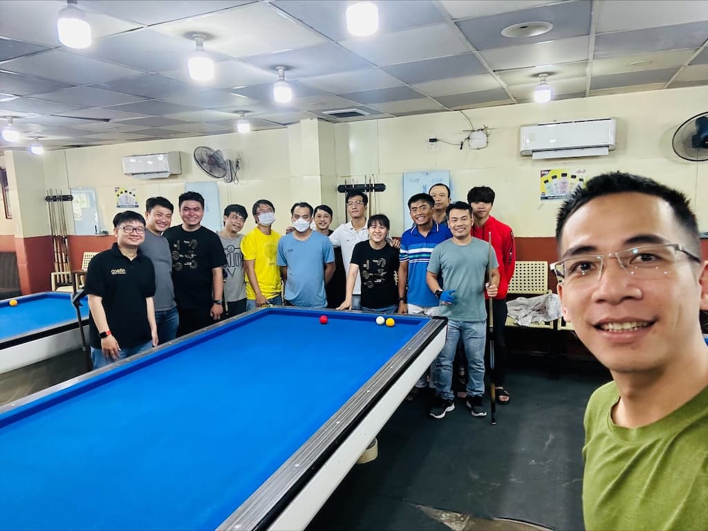 Niteco employees posing together at the billiards club