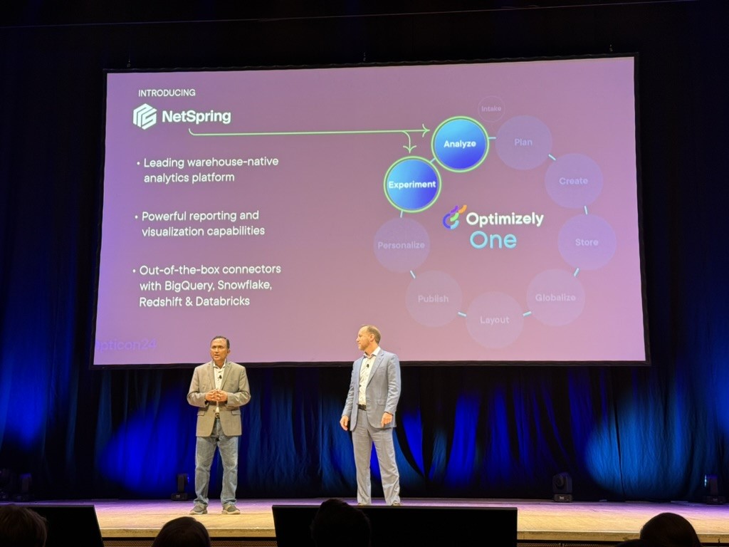 Two men on a stage

Description automatically generated