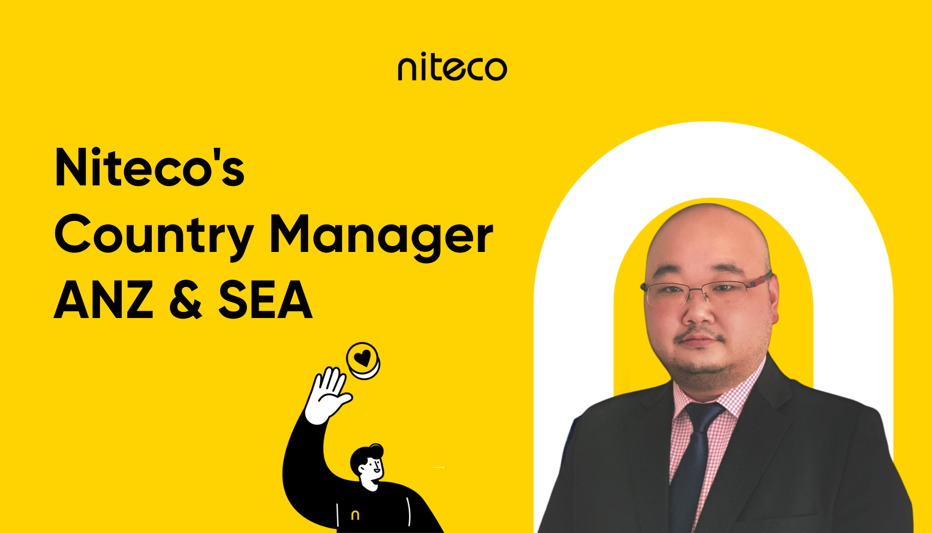 Niteco's Country Manager ANZ & SEA in suit and tie on yellow background