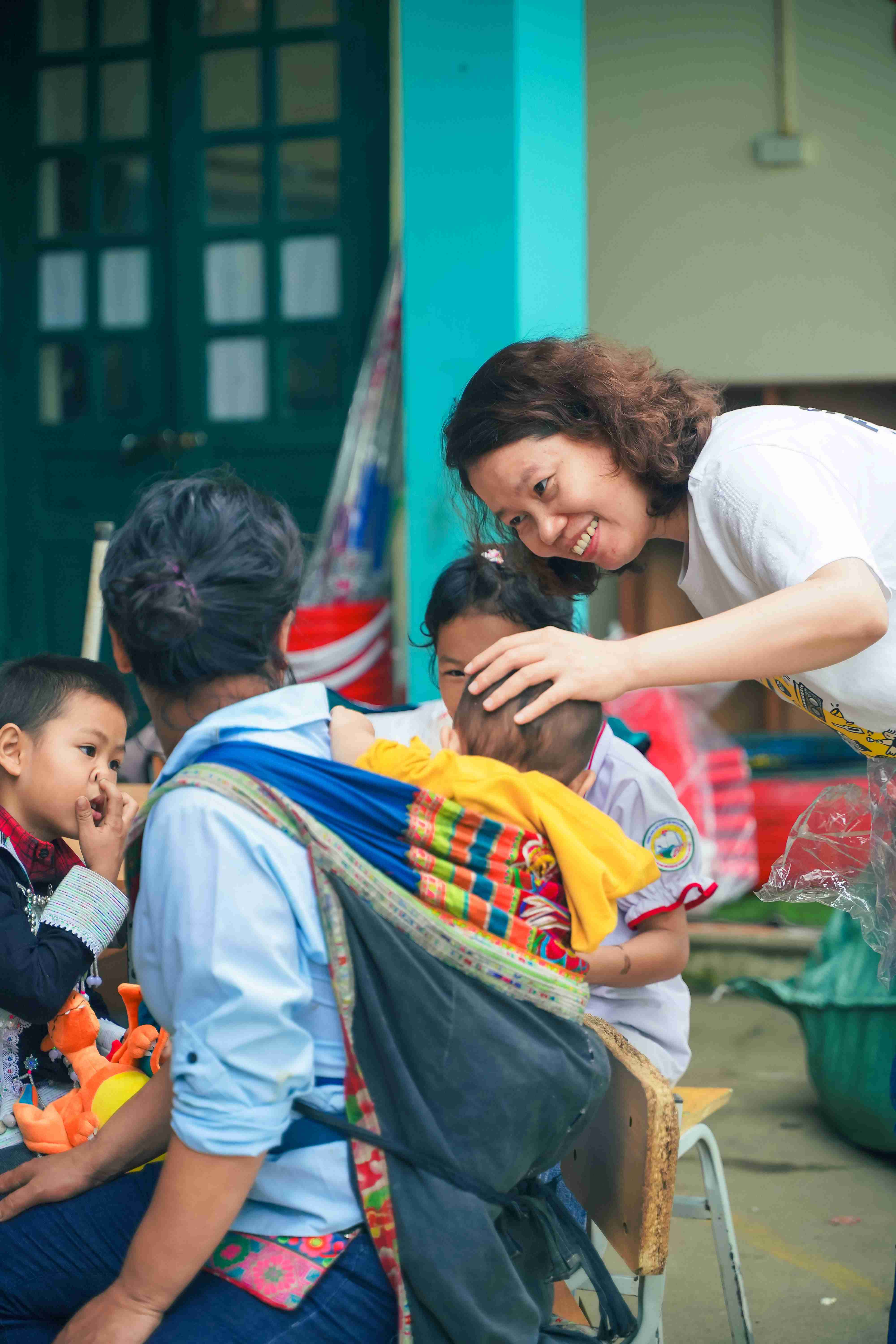 Volunteers interacting with students during visit