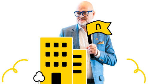 Business professional holding a flag near yellow office buildings with clouds